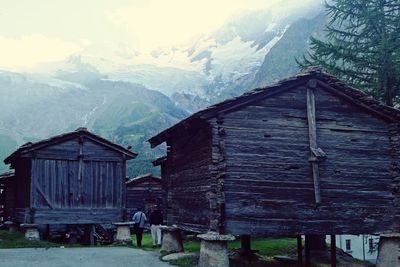 Houses against mountain range