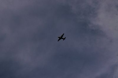 Low angle view of airplane flying in sky