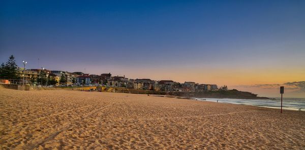 Scenic view of beach against clear sky