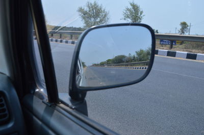 Cropped image of car on road