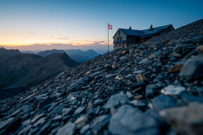 Scenic view of snowcapped mountains against sky during sunset