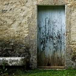 Old building wall with closed door