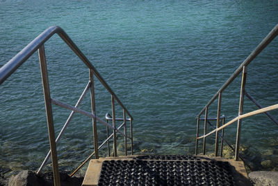 High angle view of ladder by sea
