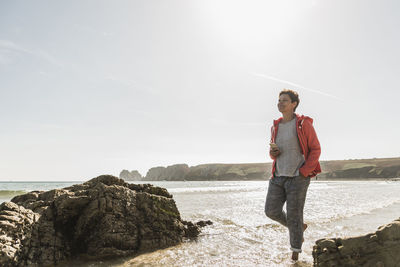 Mature woman wading in the sea