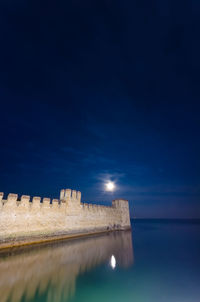 Scenic view of sea against sky at night