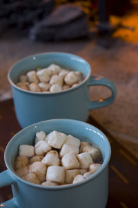 Close-up of toasts in mugs