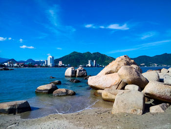 Panoramic view of sea and rocks against sky