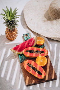 High angle view of fruits on cutting board