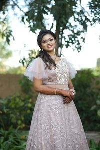 Portrait of a smiling young woman standing outdoors