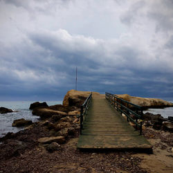 Pier over sea against sky