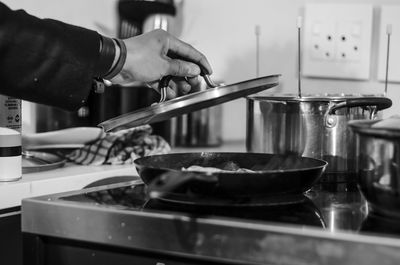 Man preparing food in kitchen at home