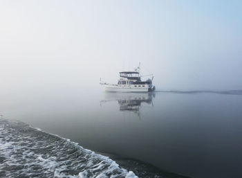 Ship in sea against sky