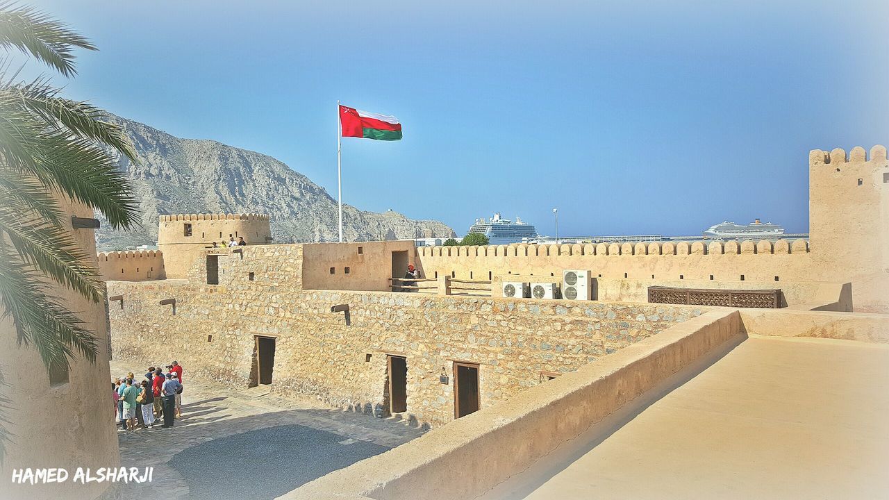 VIEW OF WOMAN WALKING ON WALL