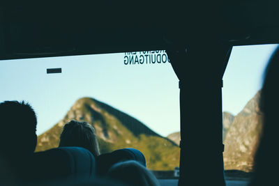 Portrait of man seen through car window