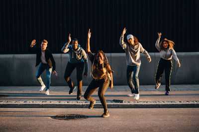 People walking on street in city at night