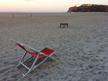 Lifeguard chair on beach against clear sky