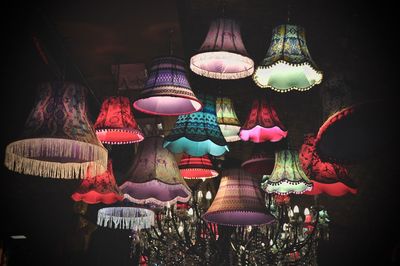 Low angle view of illuminated lamps on ceiling