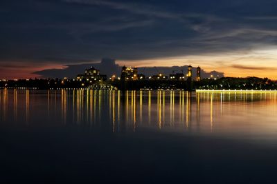 Calm sea with buildings in background