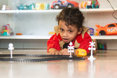 Boy playing with toy blocks