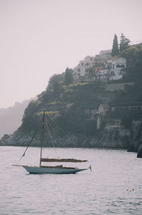 Sailboat on sea against clear sky