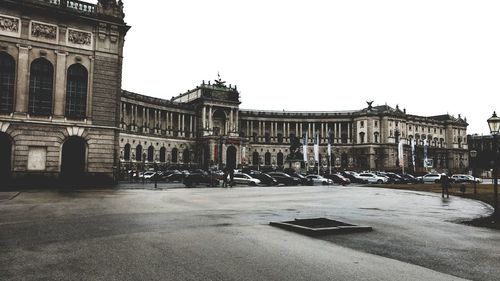 Buildings in city against clear sky