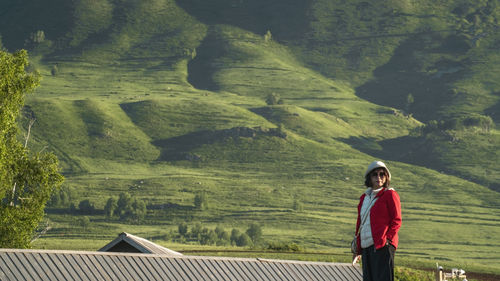 Rear view of man walking on mountain
