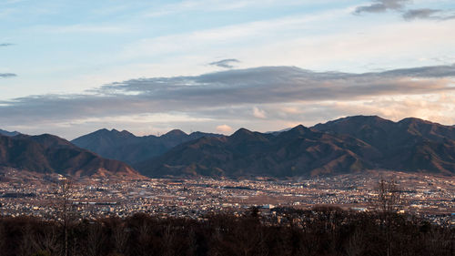 Scenic view of mountains against sky during sunset