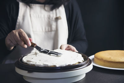 Midsection of man preparing food