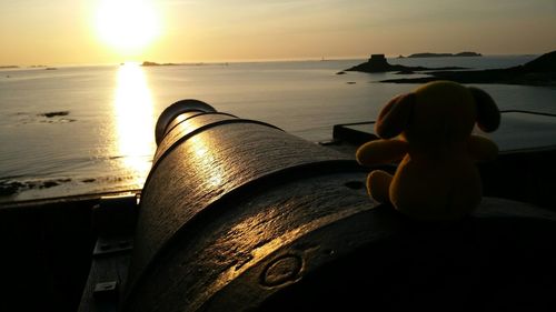 Close-up of sea against sky during sunset