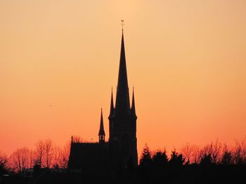 Silhouette of temple against sky during sunset