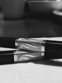 Close-up of pen on table