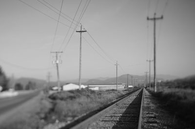 Railroad track against clear sky