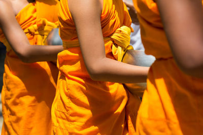 Low section of people standing in temple