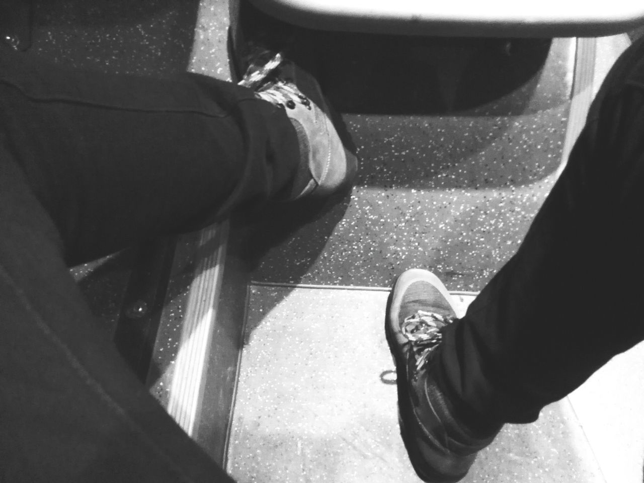 low section, person, lifestyles, shoe, men, personal perspective, standing, leisure activity, jeans, part of, human foot, high angle view, footwear, casual clothing, unrecognizable person, one man only, sitting