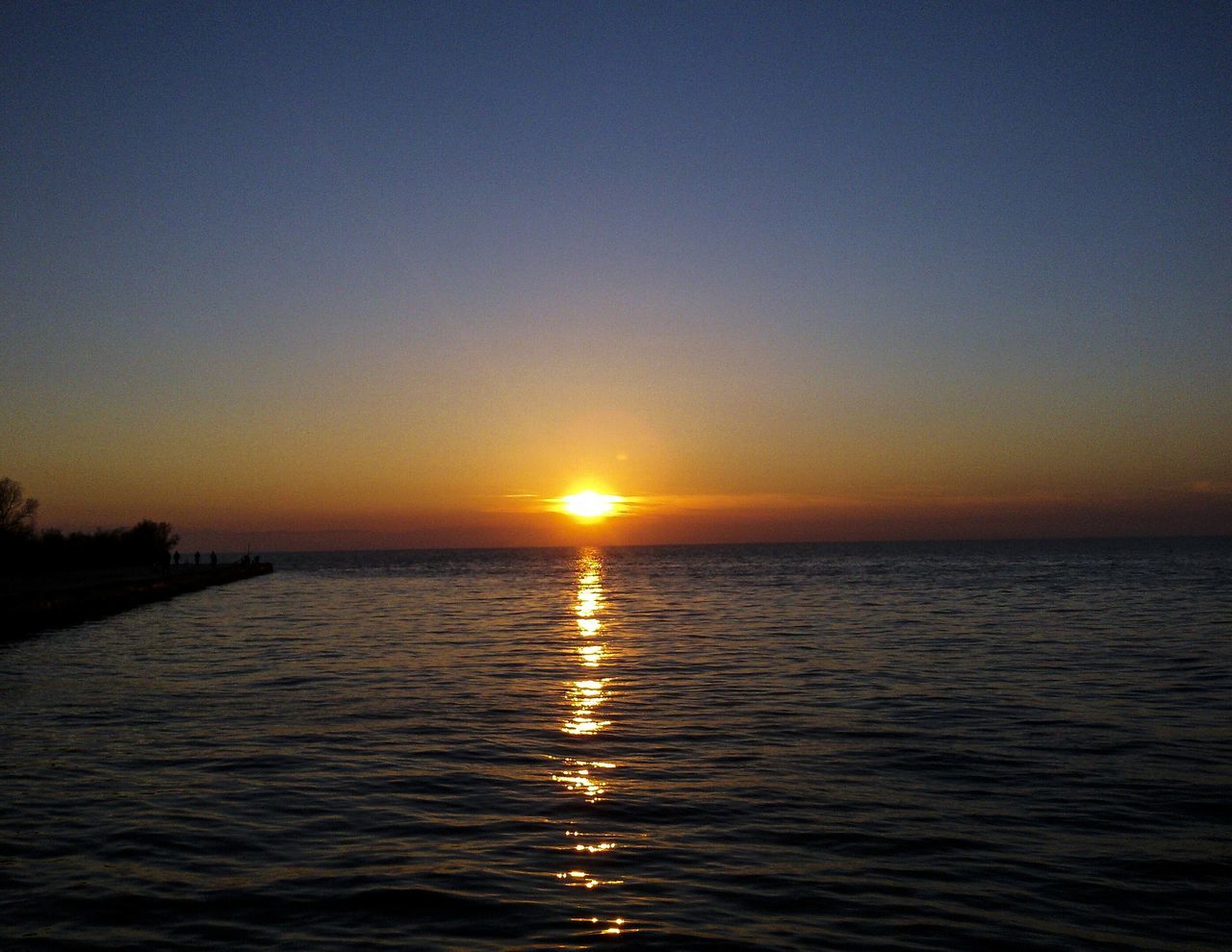 sunset, water, sky, reflection, tranquility, beauty in nature, sea, nature, scenics, tranquil scene, sun, outdoors, no people, horizon over water, day