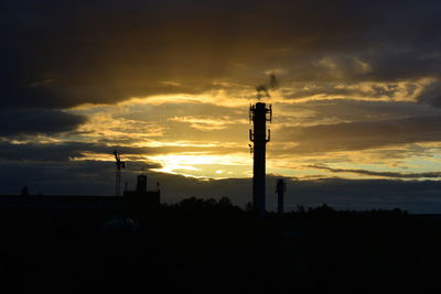 Silhouette of landscape against dramatic sky