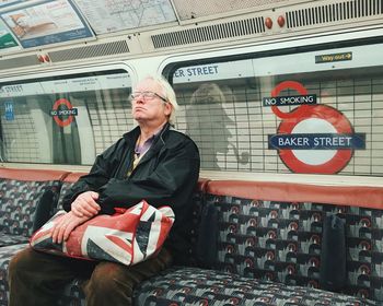 Full length of a man sitting on floor