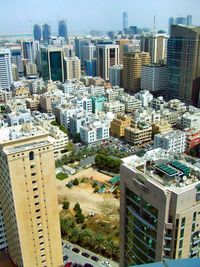 High angle view of modern buildings in city against sky