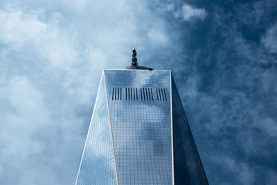 Low angle view of building against cloudy sky