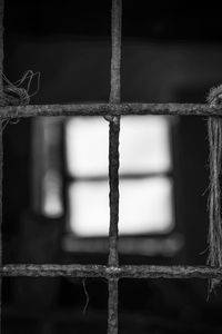 Close-up of rusty metal window on old building