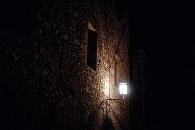 Low angle view of illuminated building at night