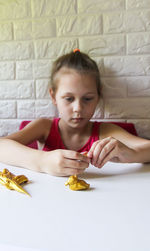 High angle view of boy eating food at home