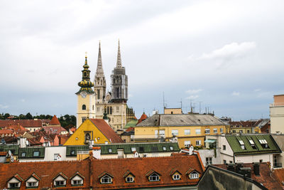 View of buildings in town against sky