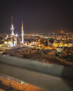 High angle view of illuminated buildings in city at night