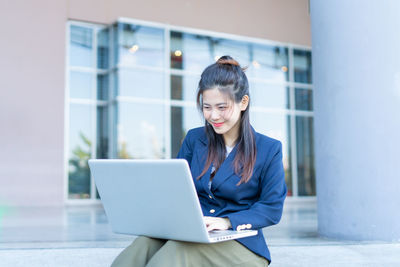 Young woman using mobile phone