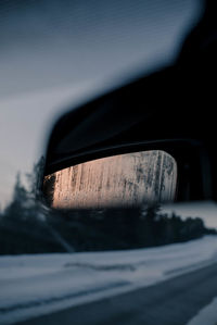 Close-up of car side-view mirror