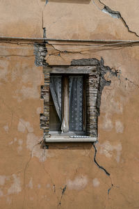 Low angle view of window on old building