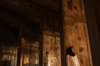 Low angle view of people standing outside building