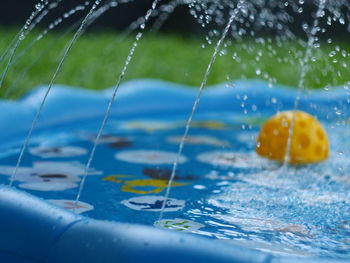 Close-up of water drops on swimming pool