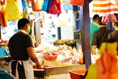 Group of people at market stall